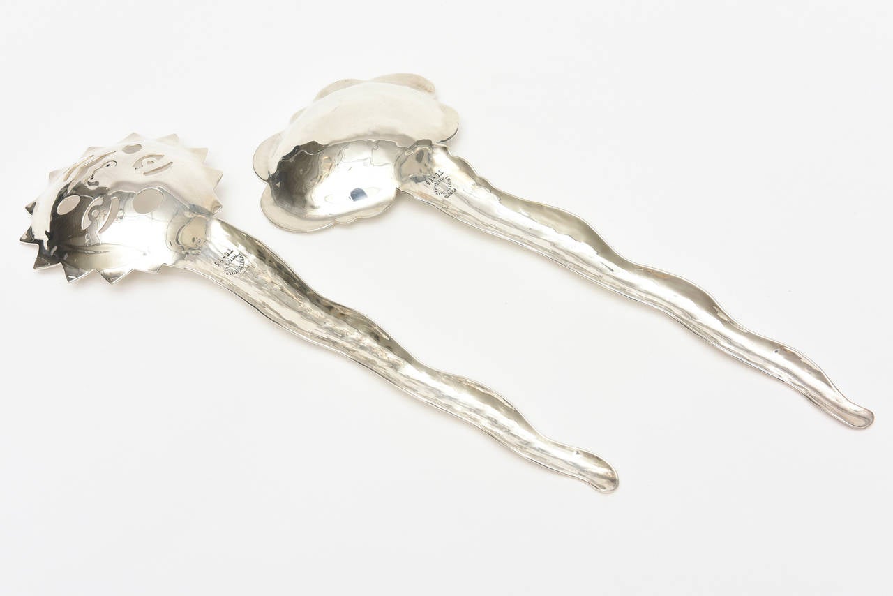 This lovely pair of hand-hammered silver plate salad servers or servers are all hallmarked, numbered and signed. They are by Emilia Castillo who is the granddaughter of the famous and collectable 
Los Castillo. They represent the sun and the