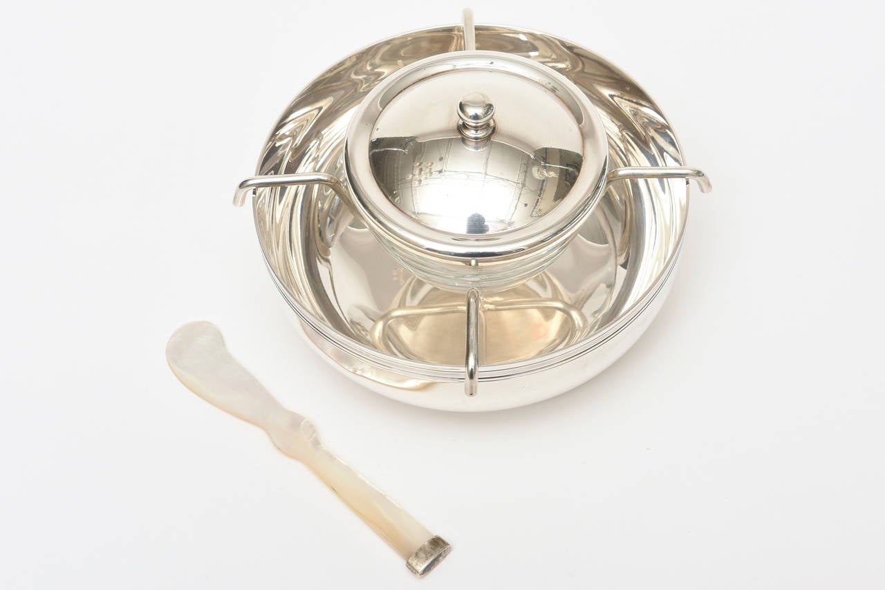 This forever caviar serving piece by Christofle will add elegance to any table.
This is from the 80s and is signed.
The beautiful mother of pearl serving spoon was always an additional price with
Christofle. The  caviar glass insert has a