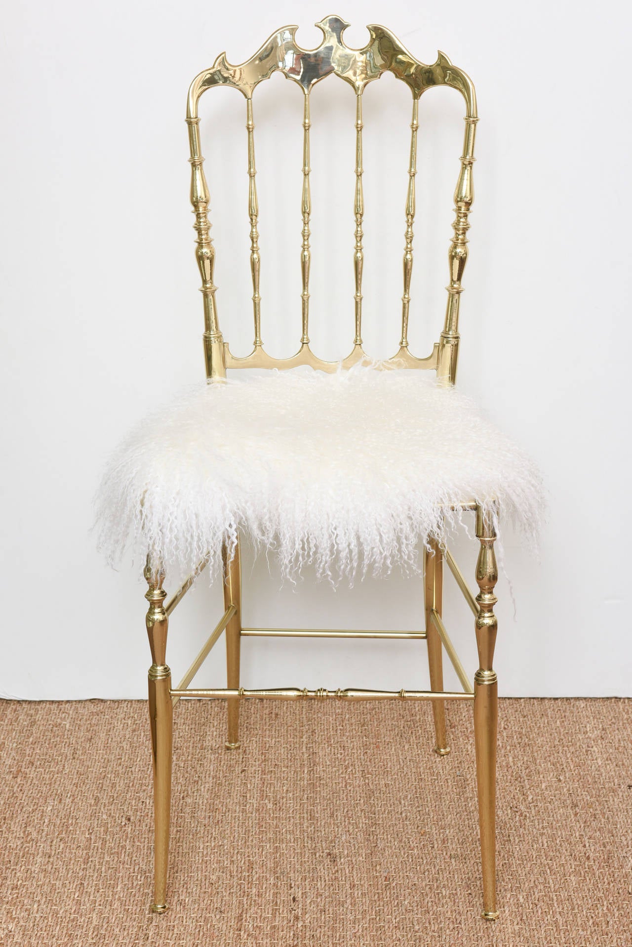 This forever Italian vintage Chiavari polished brass side chair is always timeless and makes a statement. The new upholstery is real bleached white Mongolian lamb. The entire chair has been newly professional polished and lacquered.
It glistens...