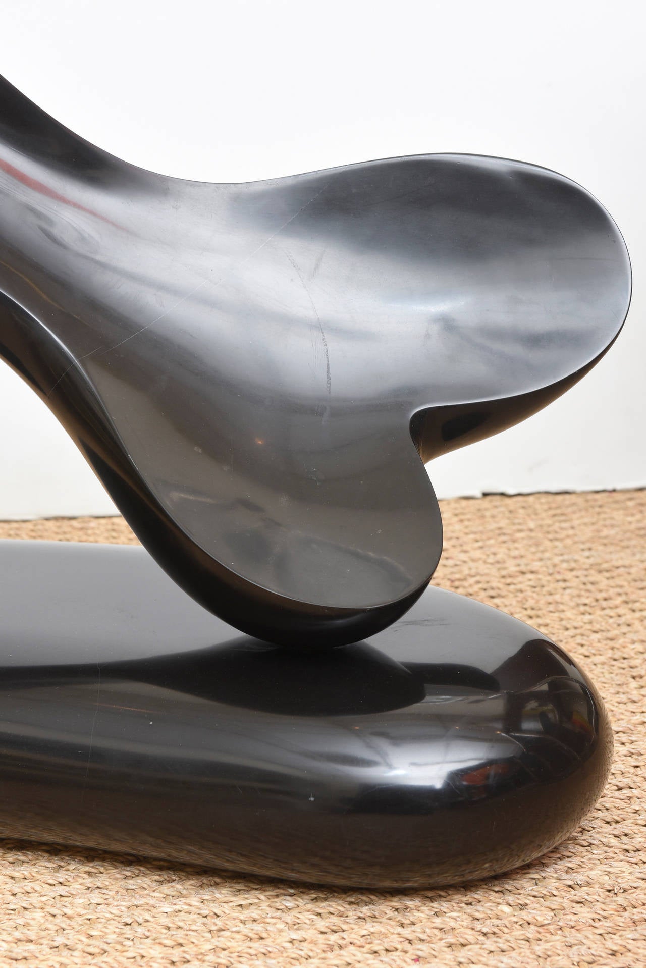 This phallic like signed abstract sculpture is by Michael Barkin. It is entitled 