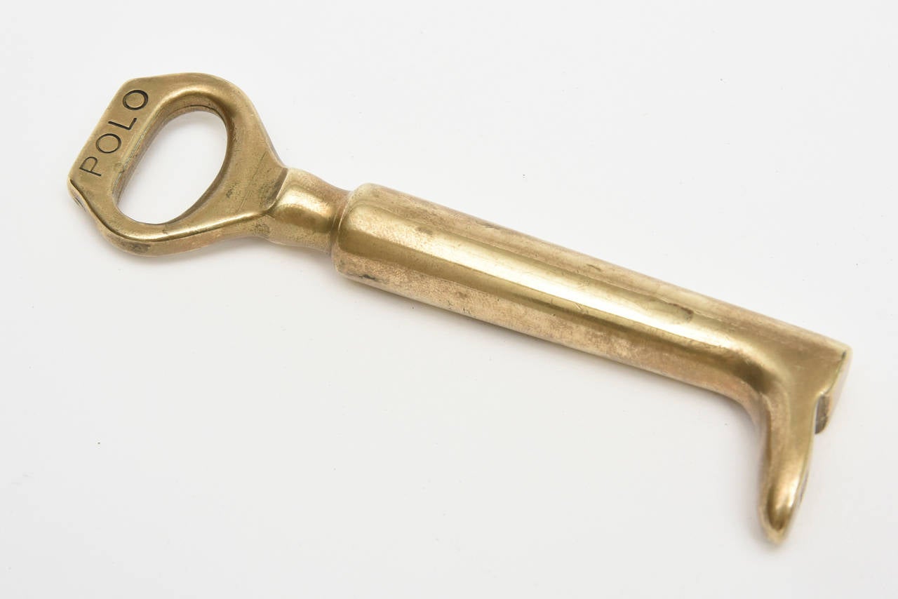 This clever solid brass polo boot bottle opener will add conversation to any bar or table setting. Sleek and fun!!
For the polo player or horse lover, this is a must and makes a great gift for that particular person.
It is stamped 