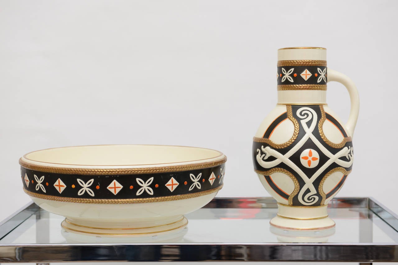 This fabulously designed successionist style hallmarked English set of porcelain pieces dates from the early 1950's yet has a modern flair.
It is successionist meets serpent Egyptian style. We have tried to do the research on this for what the