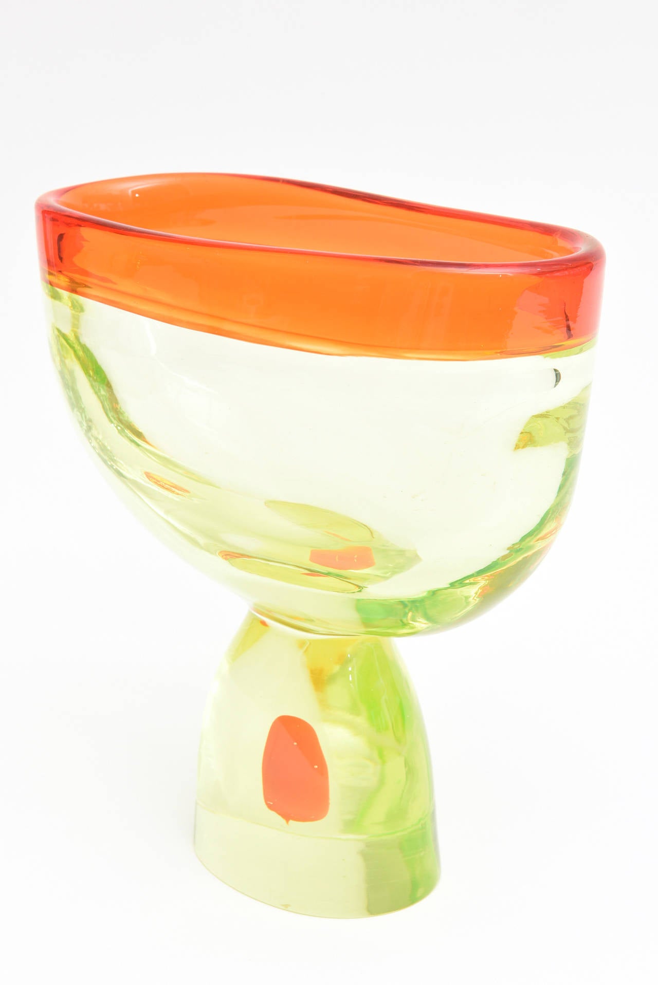 The luscious colors of chartreuse meets Hermes orange is this Italian Murano large and beautiful sommerso glass vase/vessel/object/sculpture by Antonio da Ros for Cenedese.
The top rim is Hermes orange and the orange blob on the bottom looks like it