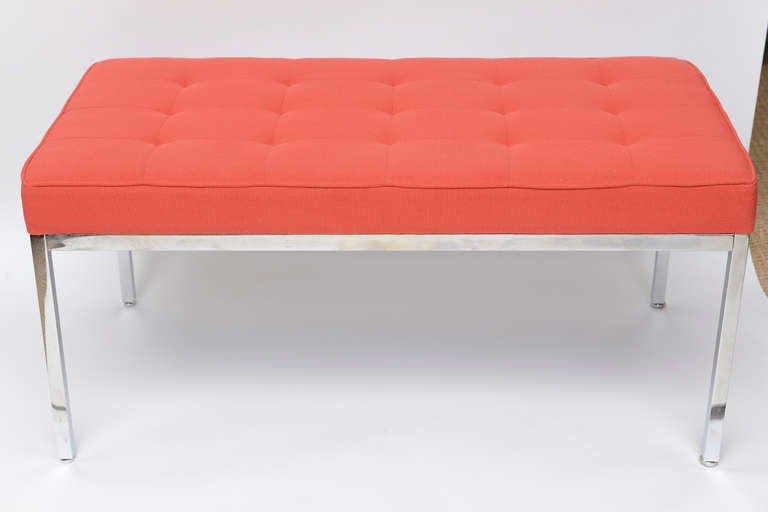 This Classic polished stainless steel bench by Florence Knoll has the original Knoll fabric on it that looks like a blue red file with buttons.

The condition is great.