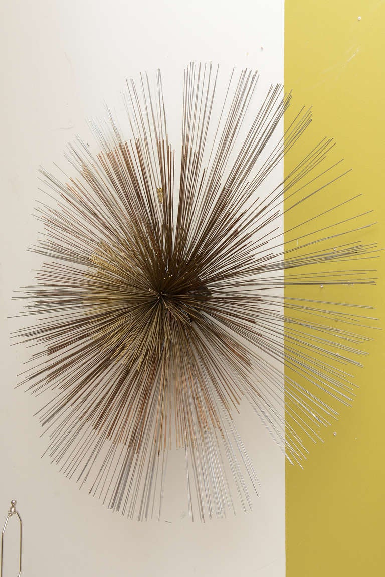 Three mixed metals make up the 3 layers that come apart of this 
unsigned Curtis Jere wall sculpture... sometimes called a large pom-pom
Silver, brass and copper
