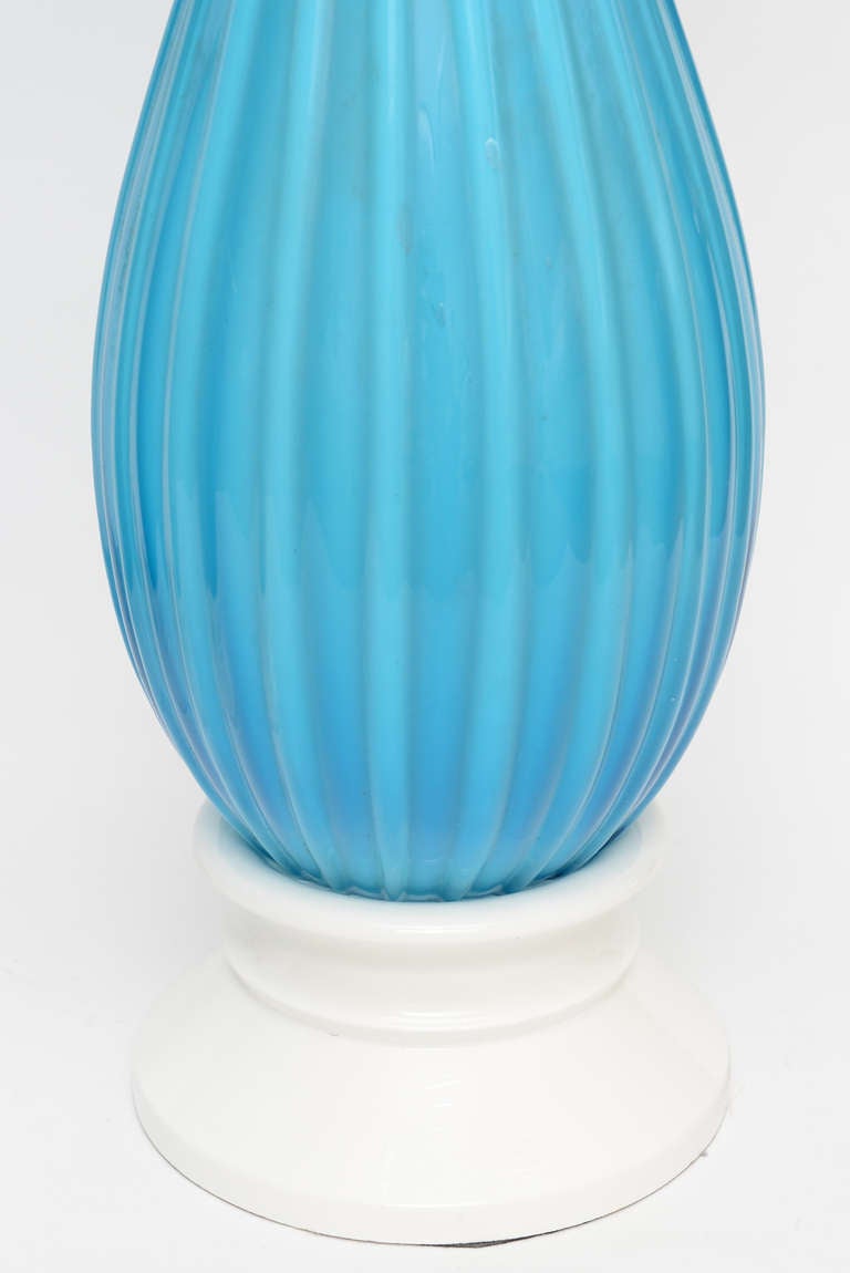 These stunning pair of vintage Mid-Century Modern Seguso for Marbro Co. ribbed luscious turquoise or Caribbean sky blue Murano glass lamps have white lacquered bases. The luminosity of the ribbed glass is very prominent and the color is stunning!