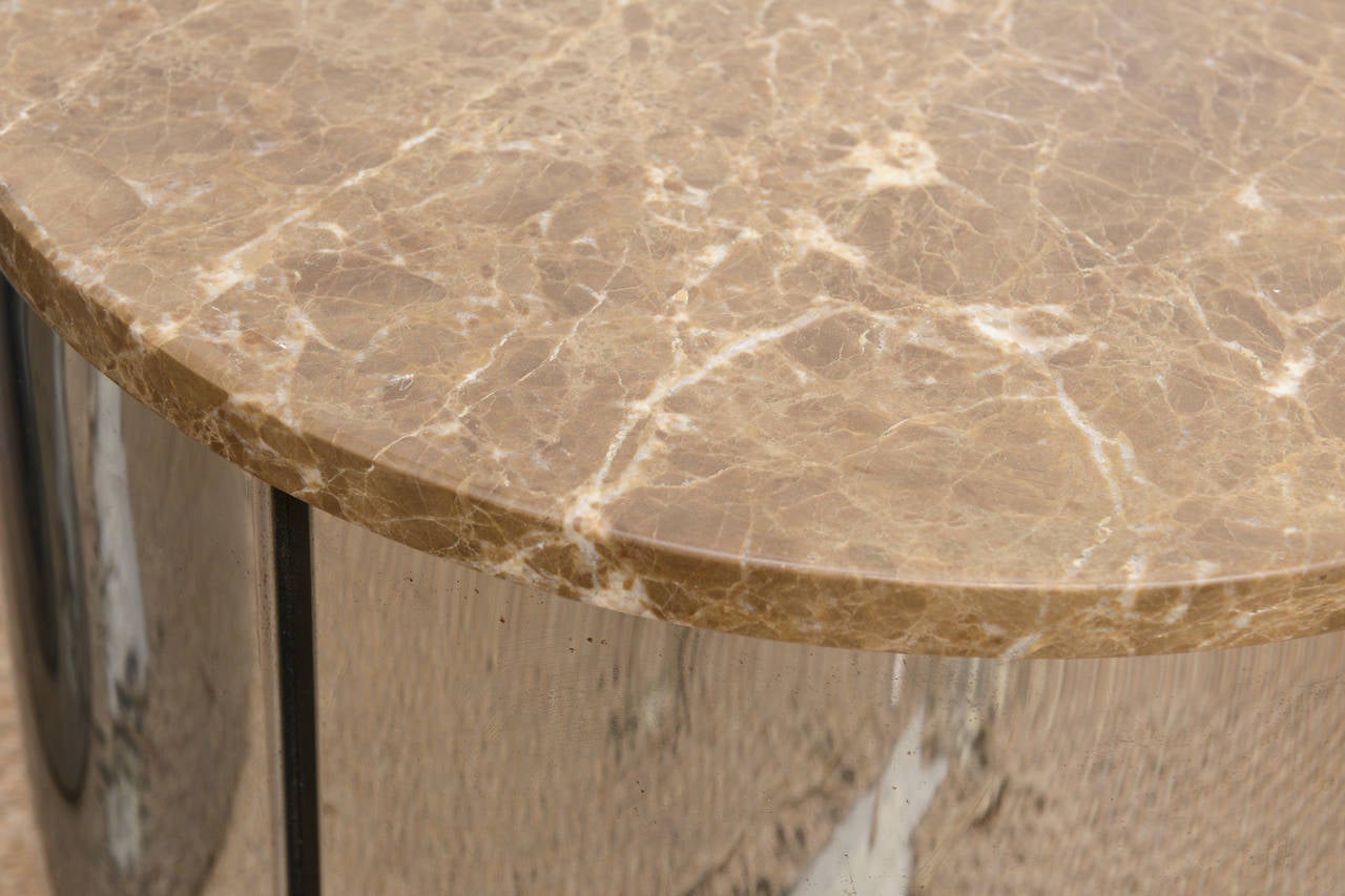 These chic side cylinder tables attributed to Pace have original marble tops in champagne and cream colors. The stainless steel circular has a good contrast to the marble.
These are so versatile.