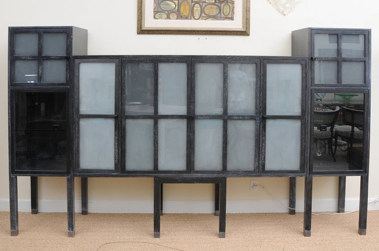 This fabulous and rare Bauhaus meets modernist style monumental cerused ash and sandblasted glass entertainment cabinet, buffet, bar, or even bookcase cabinet has wonderful storage and a very modern look. It is called the Piombo cabinet. This is