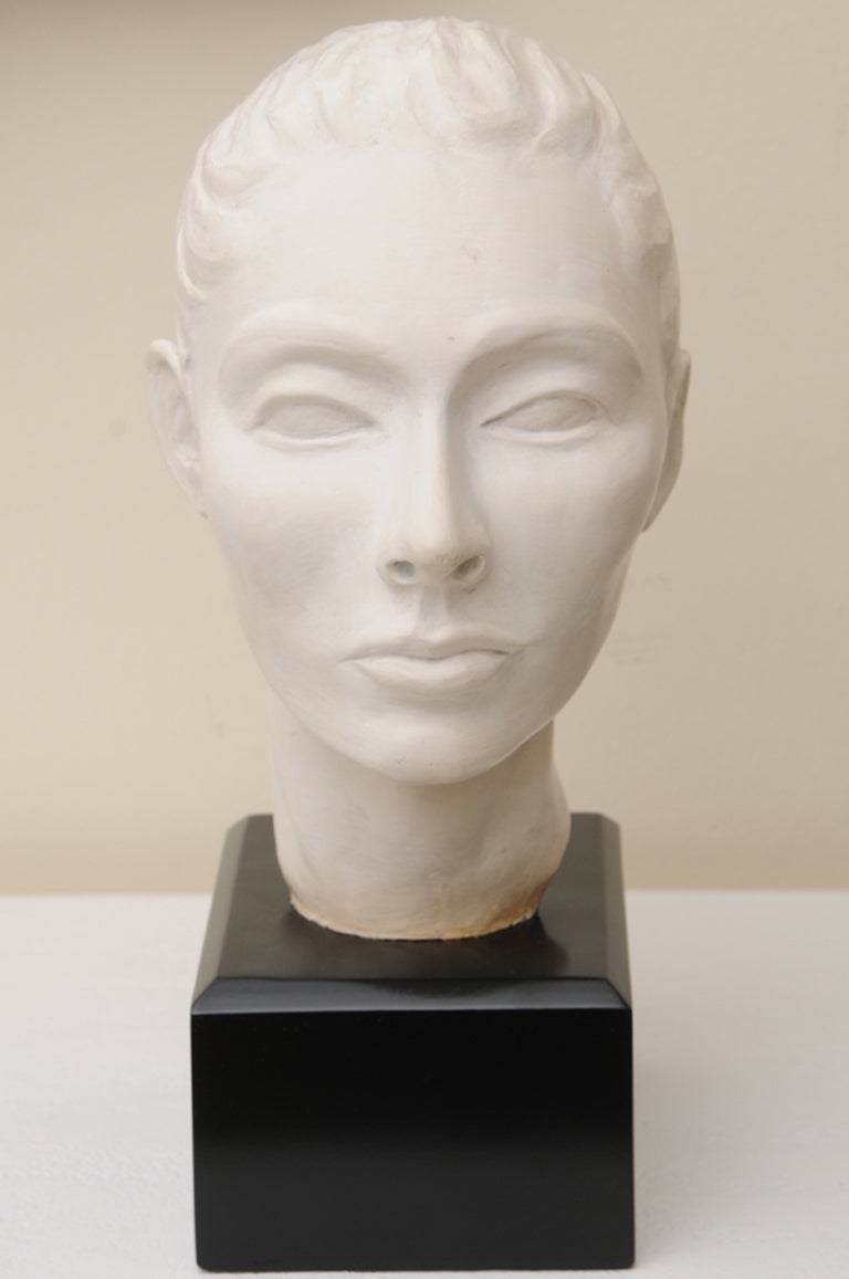 This wonderful restored Italian vintage aqualine plaster of Paris head bust sculpture is so reminiscent of what would be in a museum setting. She has beautiful surreal features with great detail to her very detailed back hair. She sits on a black