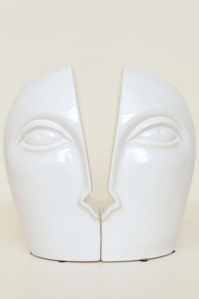 These wonderful cutout sculptural Italian ceramic faces vases are whimiscal and abstract. They angle out.
They can be placed together or separate.... two vessels/vases as one...
They are signed on the bottom by the manufacturer and are