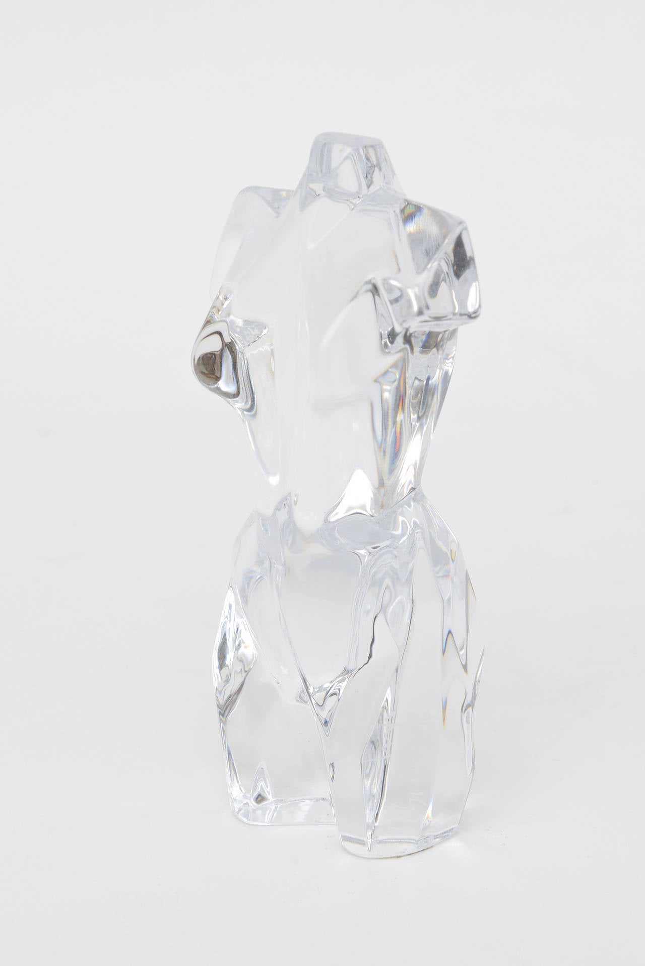 Signed Daum France, this small but lovely crystal glass torso has a cubist feel.
It has a nice weight to it.... all the sides and angles are different.