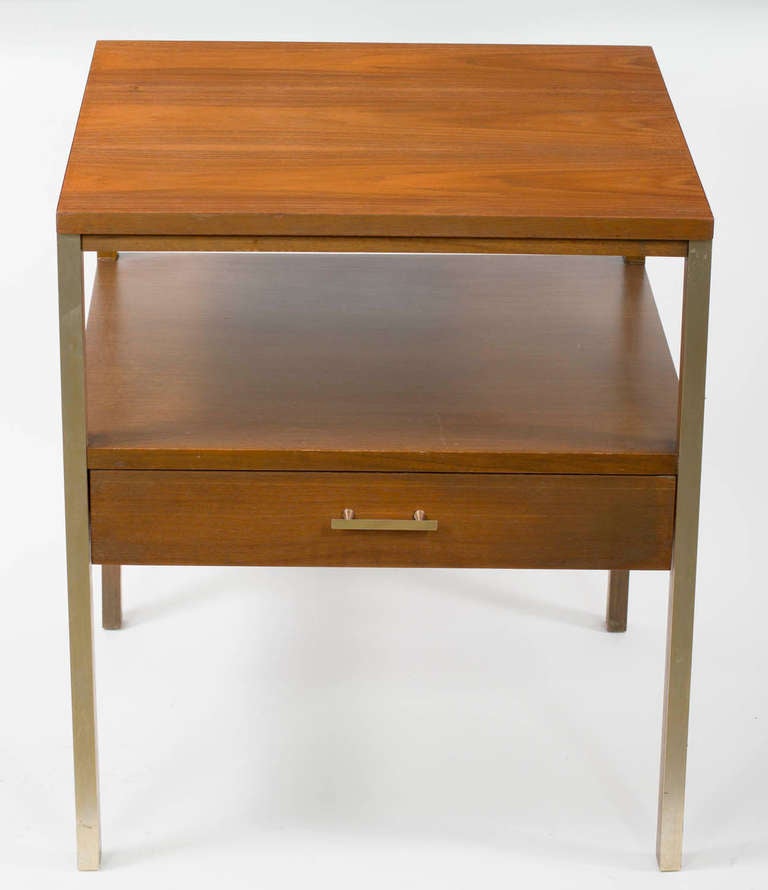 Pair of Night Tables by Paul McCobb for Calvin Group featuring
brass square legs, Walnut top and suspended drawer with a brass pull.
Calvin metal tag attached inside the drawers.