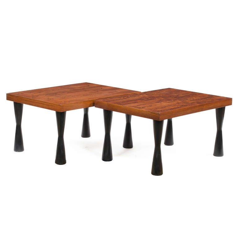 Pair of 1950s end tables in a style of E.Wormley
with beautiful and unique rosewood tops on
solid mahogany hourglass shaped legs in ebony finish.