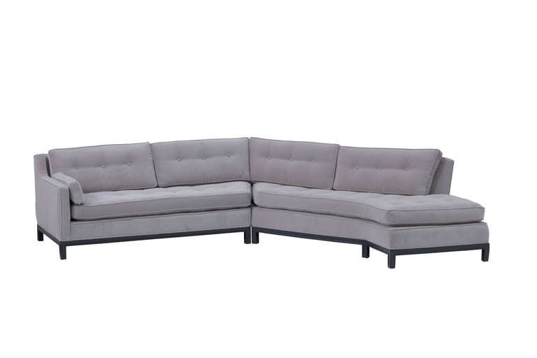 Two Piece Sofa by Edward Wormley for Dunbar with angle design
featuring mahogany base with square legs,
four tufted back cushions, two long seat cushions and arm rest
all upholstered in a new velvet with original tufting pattern.
The straight
