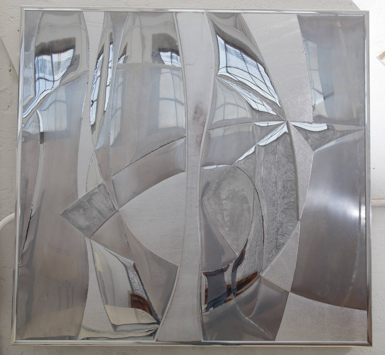 Wall sculpture with exquisite detail executed in
mirror finished steel panels, polished aluminum 
and 2