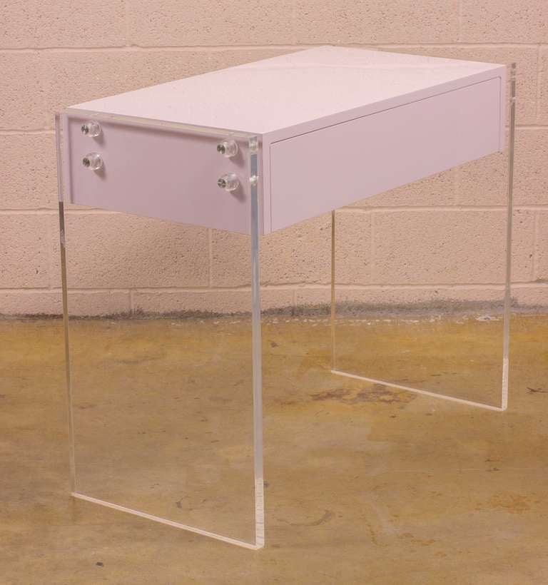 1970's Dressing Table featuring a lacquered case with one drawer
Suspended from the solid Lucite side panels.