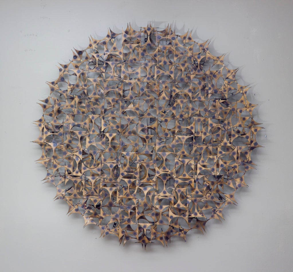 Large Wall Sculpture by Marc Weinstein in spiky metal cutouts 
with the original patina. Assembled in a three dimensional 
composition creating a great overlay pattern of light 
and shadow on the wall.