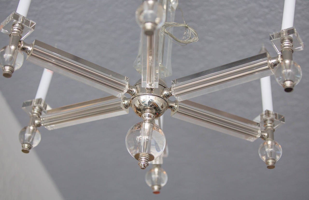Six lights crystal chandelier cut by hand,
with nickel details.