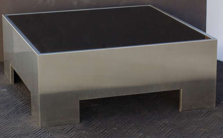 Coffee table by Milo Baughman for DIA
In cast aluminium base in brushed finish
with inserted smoky grey glass top.
 