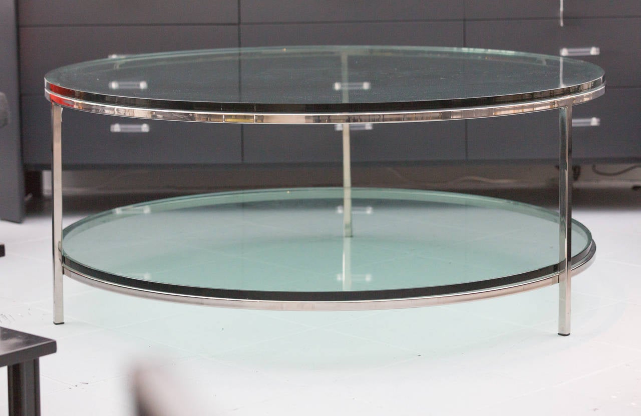 Large two-tier glass top coffee table 
by Milo Baughman
with chromed steel base and thick glass shelf.