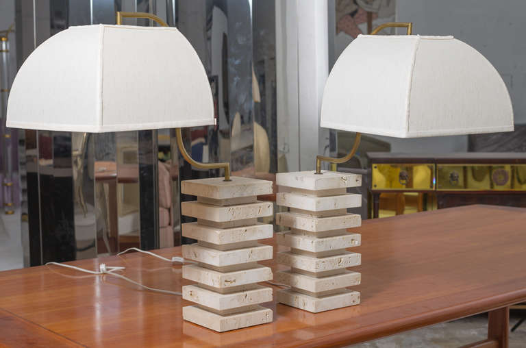 Pair of Italian Table Lamps with stacked square Travertine bases,
custom linen shades suspended from the solid brass mounts.
