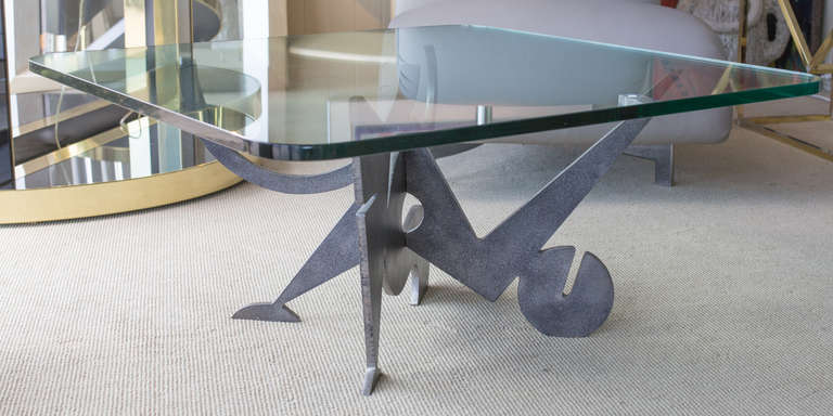 Sculptural base cocktail table by Pucci de Rossi.
In two parts with thick glass top,
36'dia round or as shown 36"square shape.
Signed at the bottom.