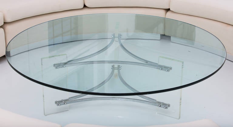 Coffee Table by Charles Hollis Jones featuring 
Lucite and steel base supporting 60"diameter glass top.