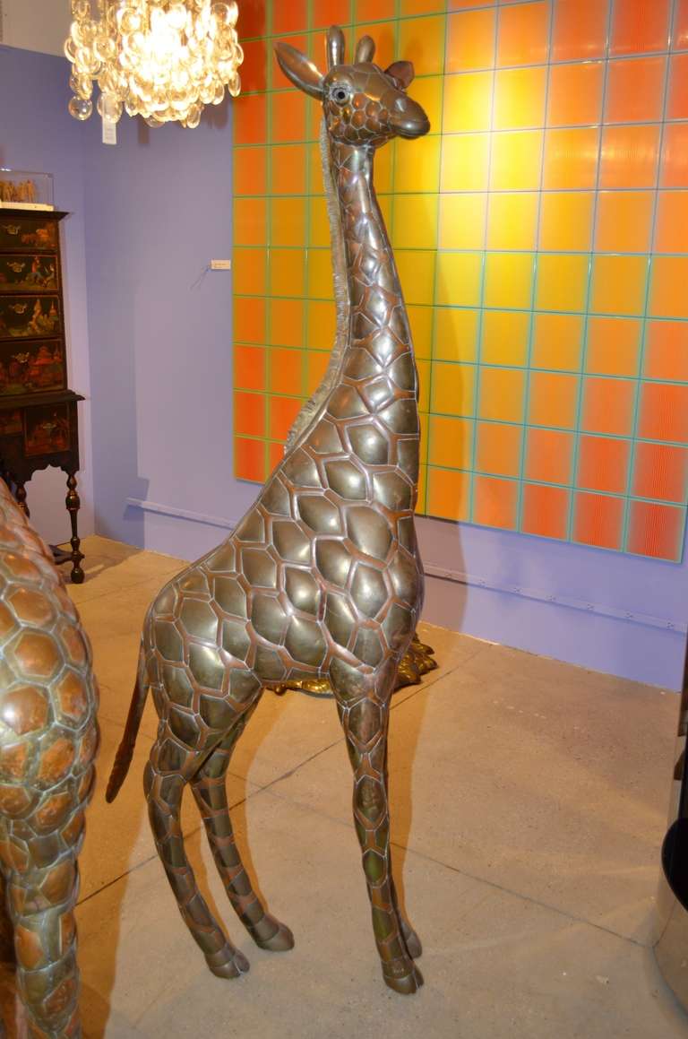 Early 1970's brass and copper sculpture of the Baby Giraffe by 
Bustamante Brothers.
Signed SERMEL and numbered 1/100.
On display at our MIAMI location.
By appointment only.