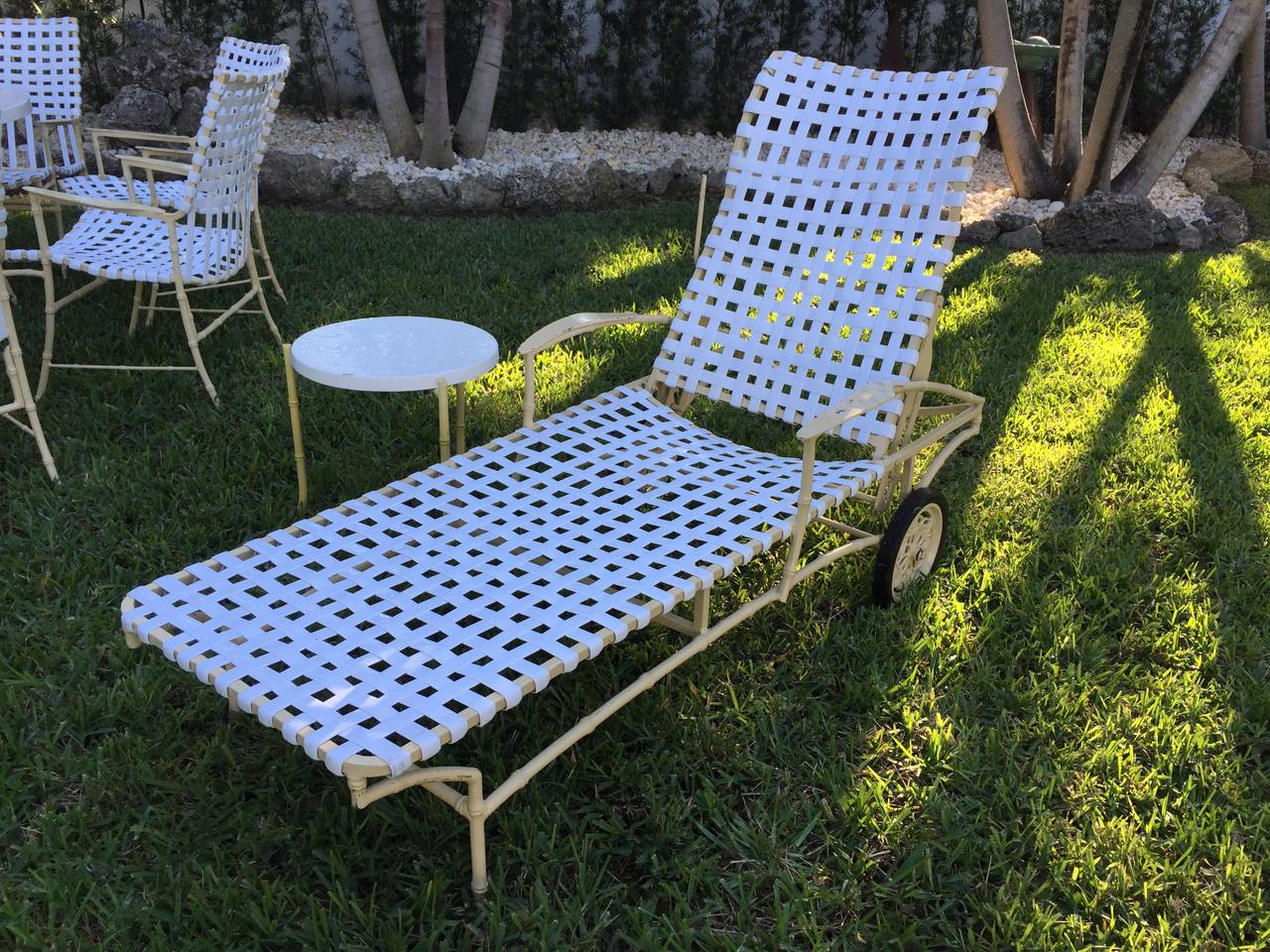 1960s in all original condition - this wonderful grouping of dining table and six chairs, rocker chair, reclining chaise longue, two side tables and a chair and ottoman. The white straps are all in-tact and the soft butter yellow painted aluminum