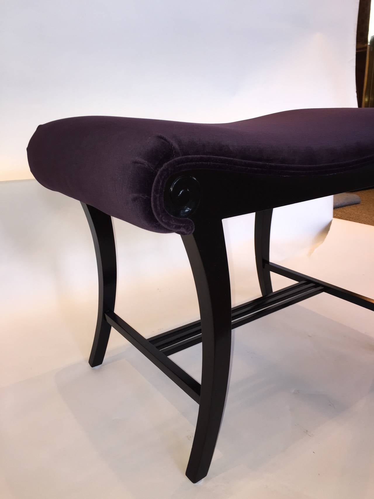 Newly upholstered in purple velvet, this beautiful Art Deco ebonized stool is perfect for any decor.