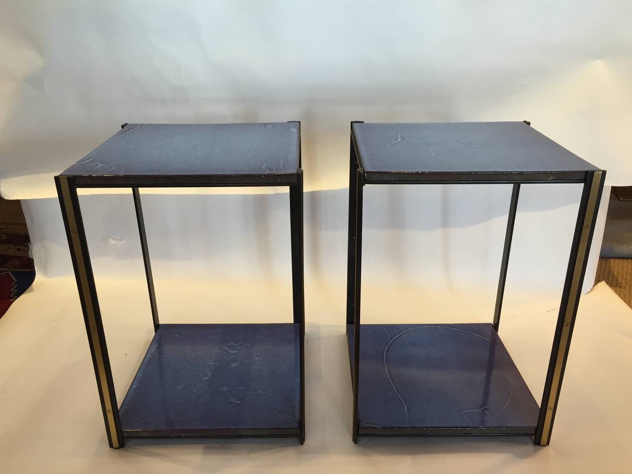 Yves Klein blue vibrant handmade square plateaus on two-tiers. Custom details include brass trim.