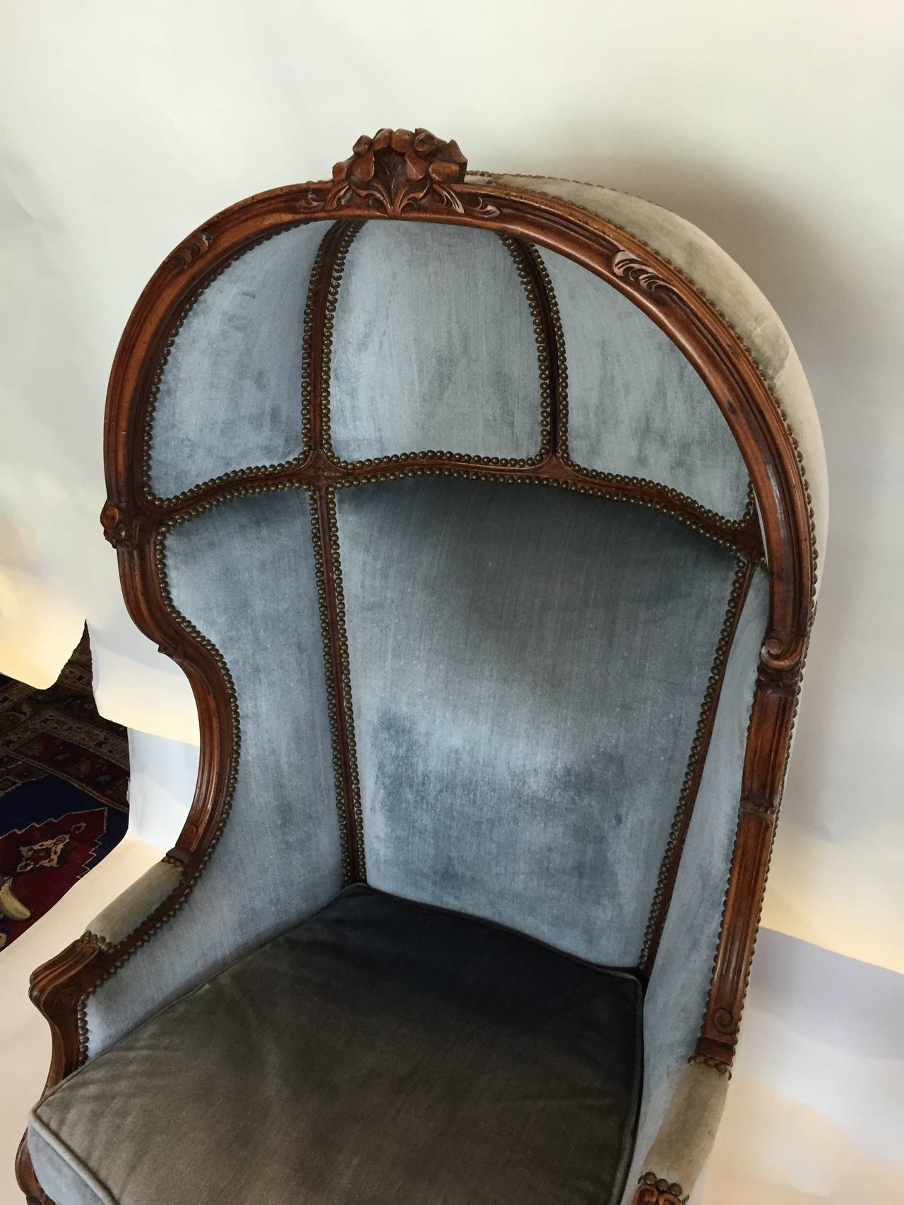 Original vintage velvet and carved wood, this canopy chair is a perfect accent for any modern design.