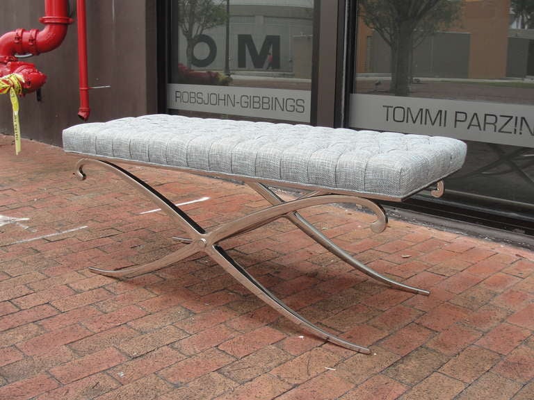 Rich and luxurious bench with new upholstery and polished steel frame.