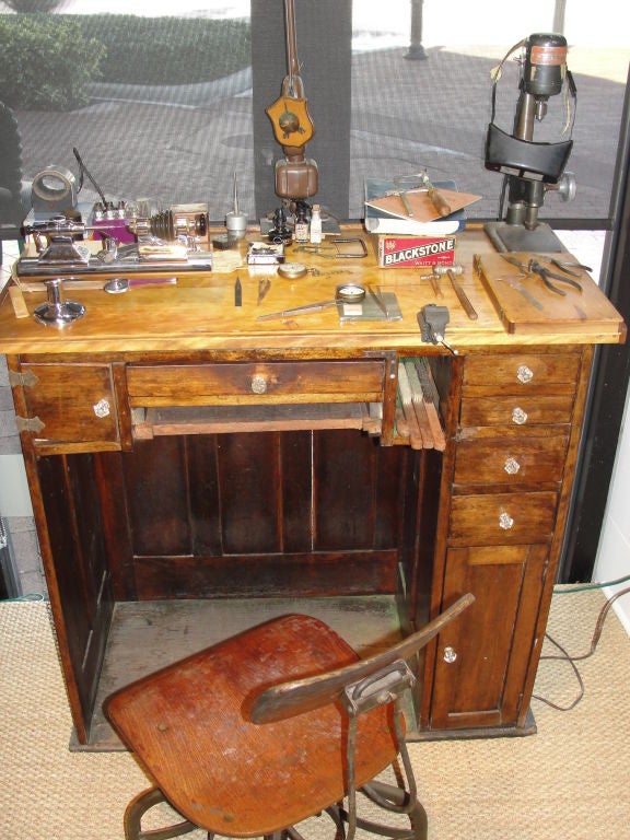 WOW!!!!  Like travelling back in time, this amazing desk is like a folk art installation.  Every drawer and nook are FILLED with hundreds of miniscule parts and precision tools used for over 60+ years.  This has been impeccably preserved as it was