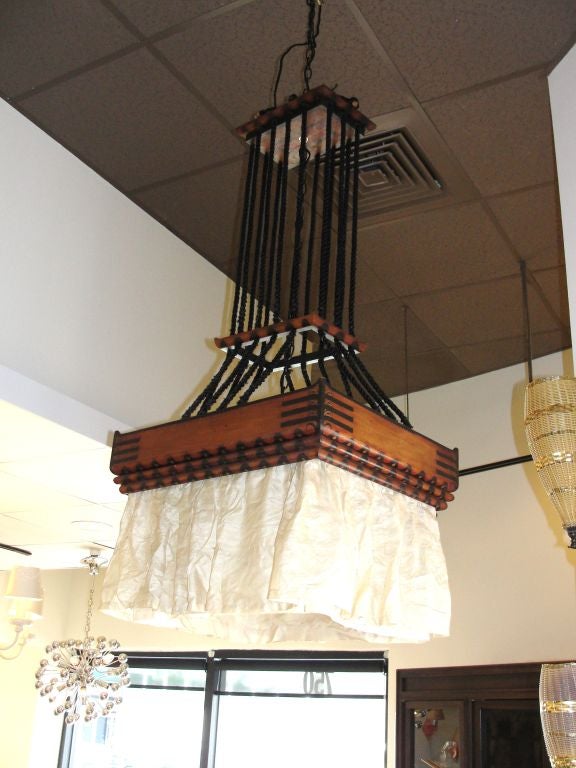 20th Century A Stained Wood Chandelier  By Louis Bogtman