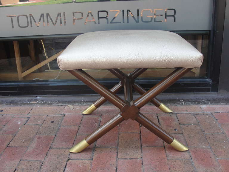 Luxurious X-shaped ottoman with oversized brass caps to feet and rich leather in faux shagreen.

This item is currently in our East Hampton showroom.