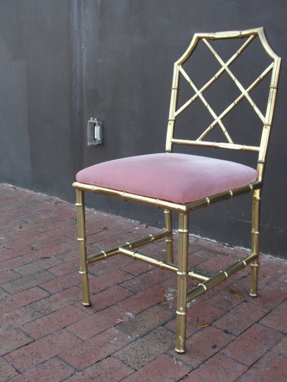 Heavy brass and vintage Dior pink velvet (may want to replace) - this chair is a great desk chair or a decorative piece for its stylish look.