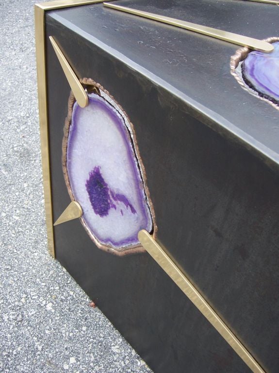 Extraordinary design of free floating agate slices in purple tones. Polished brass spines decorate and accentuate this amazing table. VERY HEAVY (300 lbs approx.). Six large slices of purple colored agate placed strategically in this unique design.