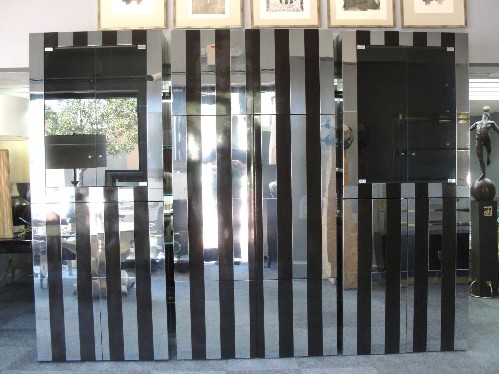 The center section opens to a TV cabinet with shelving for equipment above and below. The chrome and chocolate lacquer is stunning in this grouping.  Lateral cabinets are for stemware and dry bar.
Individual Dimensions as Follows: Left and Right