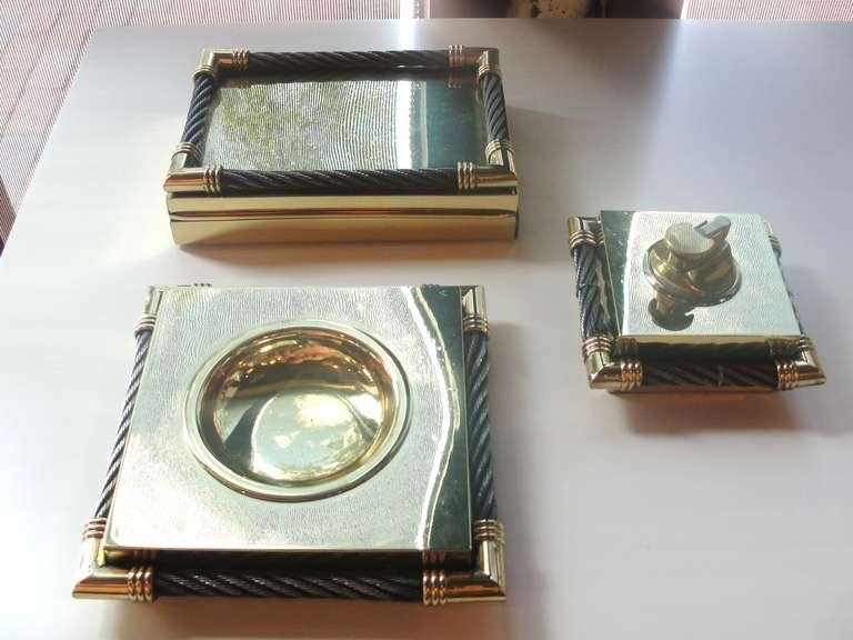 Exceptional three pieces smoking set in brass and steel - very Chic!

This set was acquired in Argentina.

Lighter will need to be filled w/ fluid

Keyword: Hermes, Cartier, gucci

Box : 7