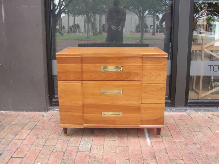 Vintage modern three drawer dressers with brass pulls and matching leg caps. Nicely sculpted front, tapered legs, deep drawers. Designed by John Widdicomb.