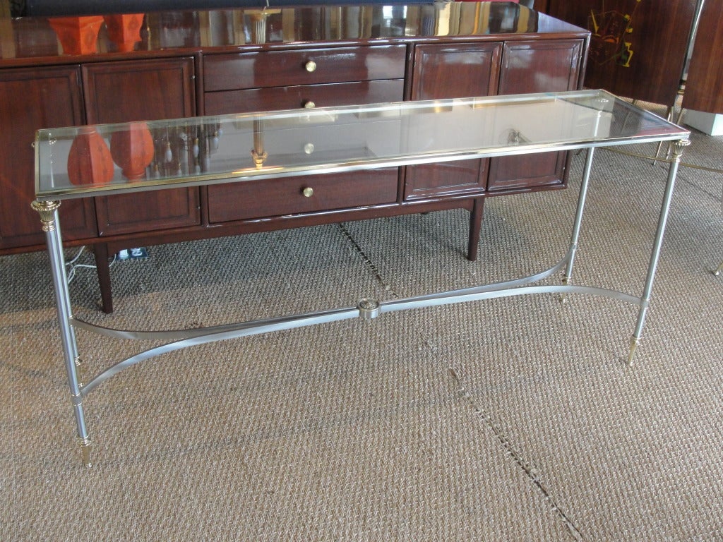 Two-Tone brushed steel and brass console.

This item is currently in our MIAMI facility.