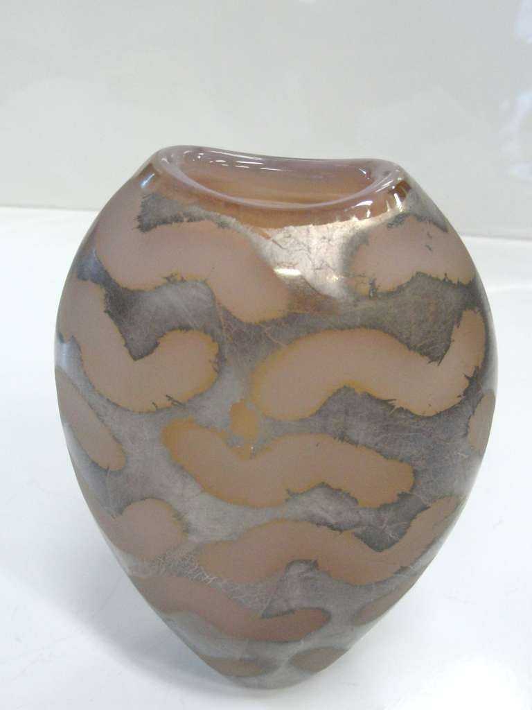 This has a silver fusion metal painted overlay - reminiscent of an animal print.  Extremely rare piece of glass.