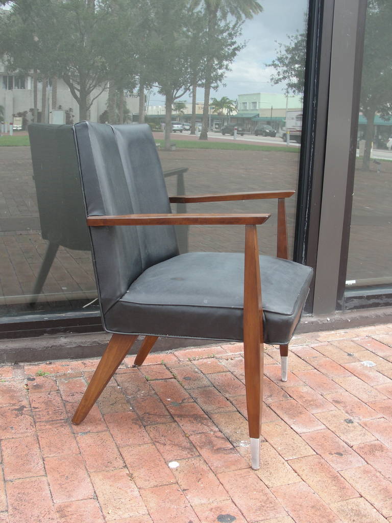 The most beautiful Mahogany desk chair influenced in a Gio Ponti design.  Finished with sabots and a split back rest.
