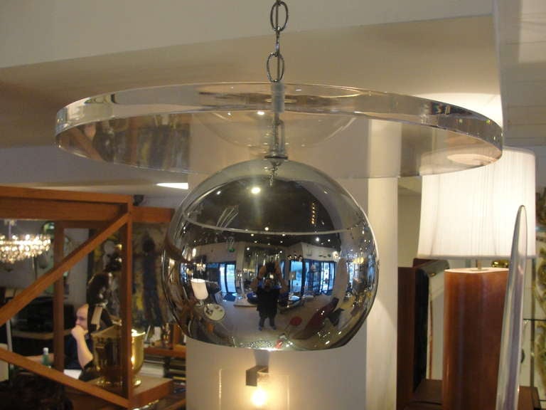 Beautifully designed, this hanging light combines chrome and lucite in the best way.