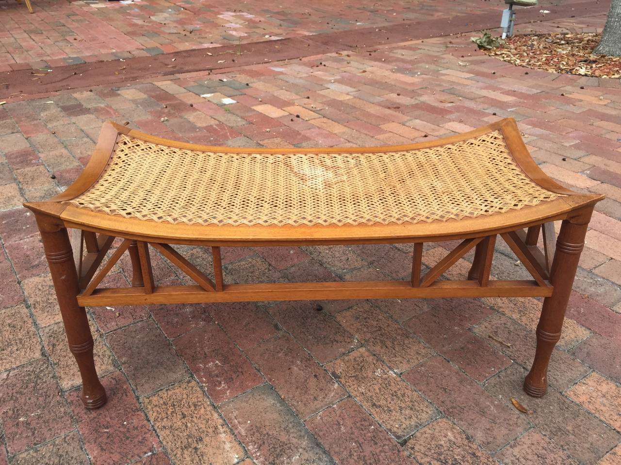 This is a very rare Liberty & Co. long form Thebes stool, circa 1910. Finely woven seat top, very strong and sturdy.