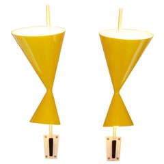 A Pair of Mid-Century Metal Wall Sconces in the style of Mathieu Matégot
