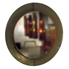 A Round Wall Mirror with an Etched Glass Bowl Shaped Frame
