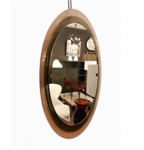 A multi level mid century wall mirror featuring a double level frame of amber and brown glass onto which is attached a central clear mirror. All three levels are held in place via two bronze clips. The mirror is fully documented. By Fontana Arte,