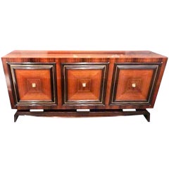 An Art Deco Three Door Sideboard in the style of Maxime Old
